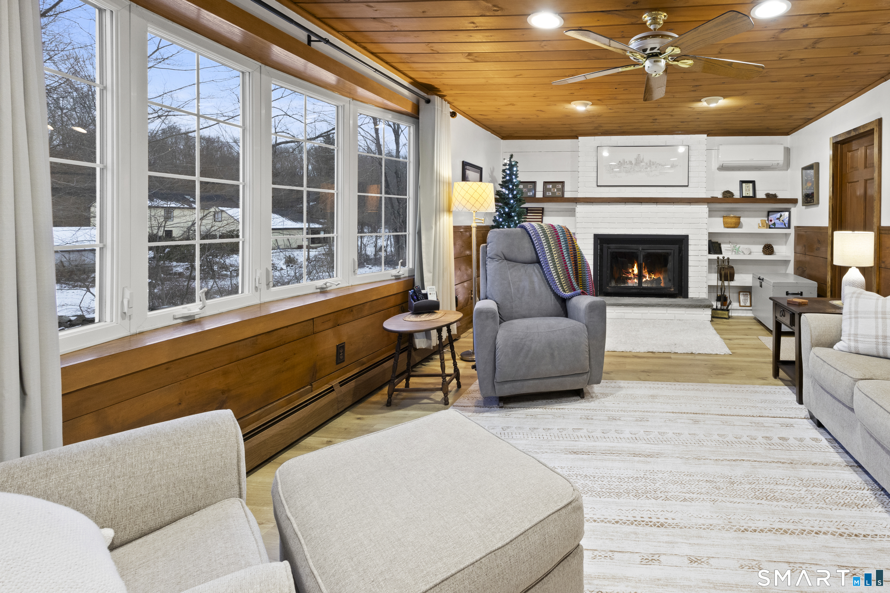 204 Paine Road Pomfret, CT 06259 - Photo 10 of 32 a living room with furniture and a fireplace