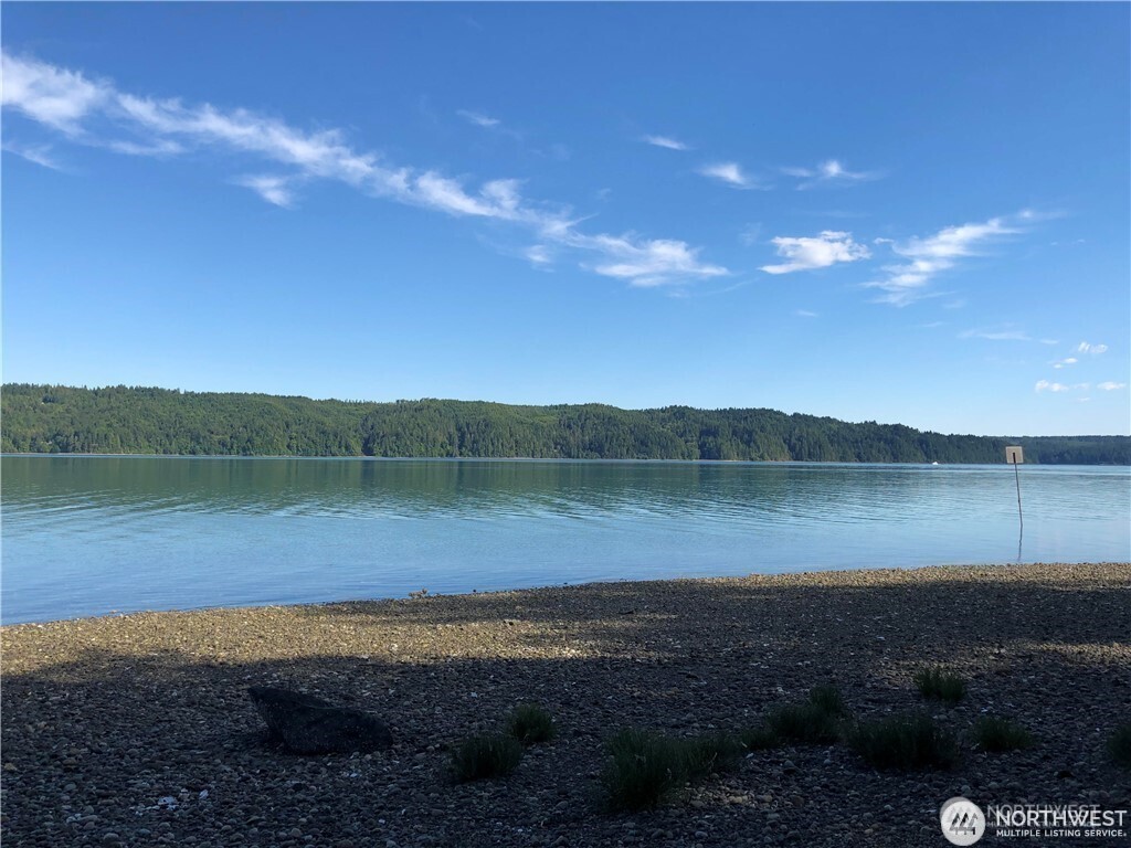 3760 Highway 101 Florence, OR 97439 - Photo 7 of 38 a view of a lake from a yard