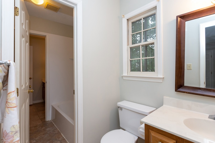 6917 Sandringham Drive Raleigh, NC 27613 - Photo 17 of 25 You have to love having your own sink and toilet! Second Master bath