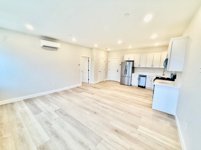 220 Winthrop Street, Unit 304 Winthrop, MA 02152 - Photo 3 of 11 a view of kitchen with wooden floor