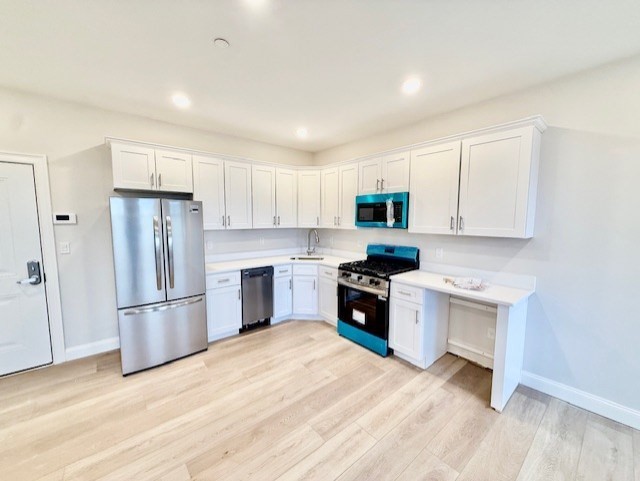 220 Winthrop Street, Unit 304 Winthrop, MA 02152 - Photo 4 of 11 a kitchen with granite countertop a refrigerator stove top oven and sink