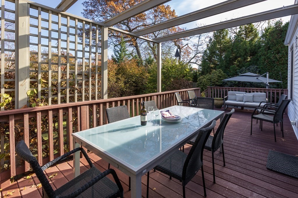 47 Arlington Road Brookline, MA 02467 - Photo 14 of 29 a view of a balcony with table and chairs