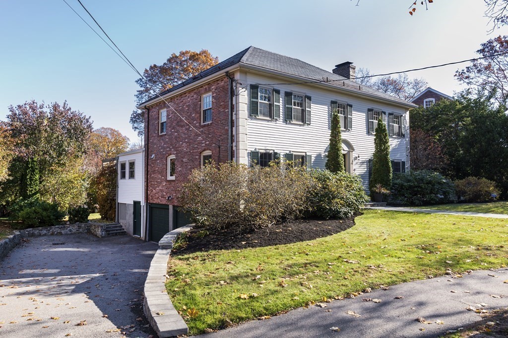 47 Arlington Road Brookline, MA 02467 - Photo 2 of 29 a front view of a house with garden