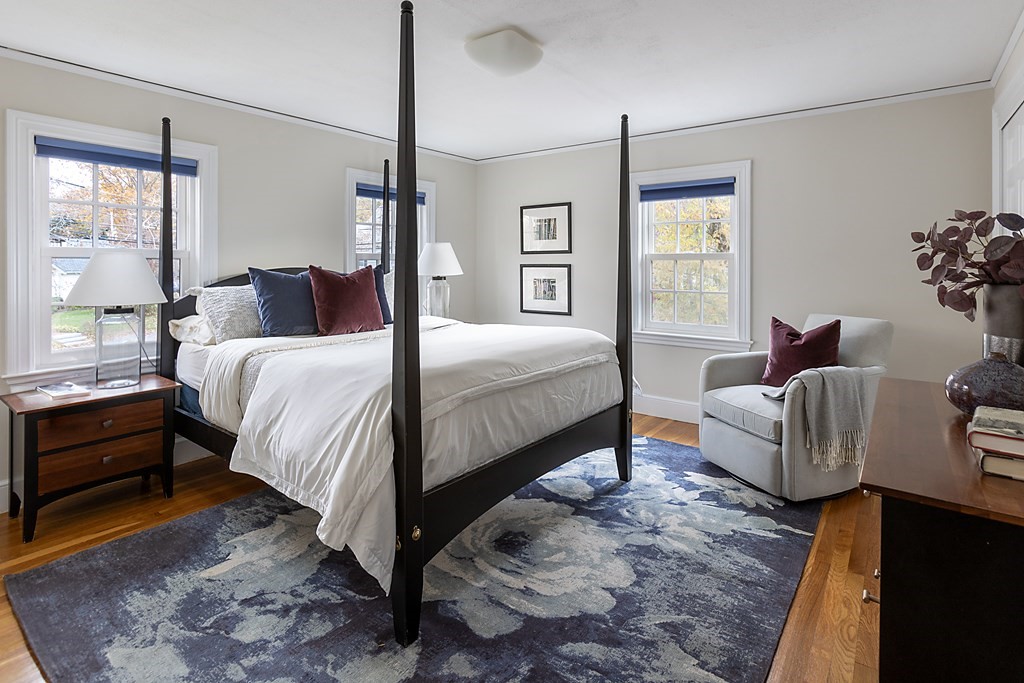 47 Arlington Road Brookline, MA 02467 - Photo 21 of 29 a bedroom with a bed and wooden floor