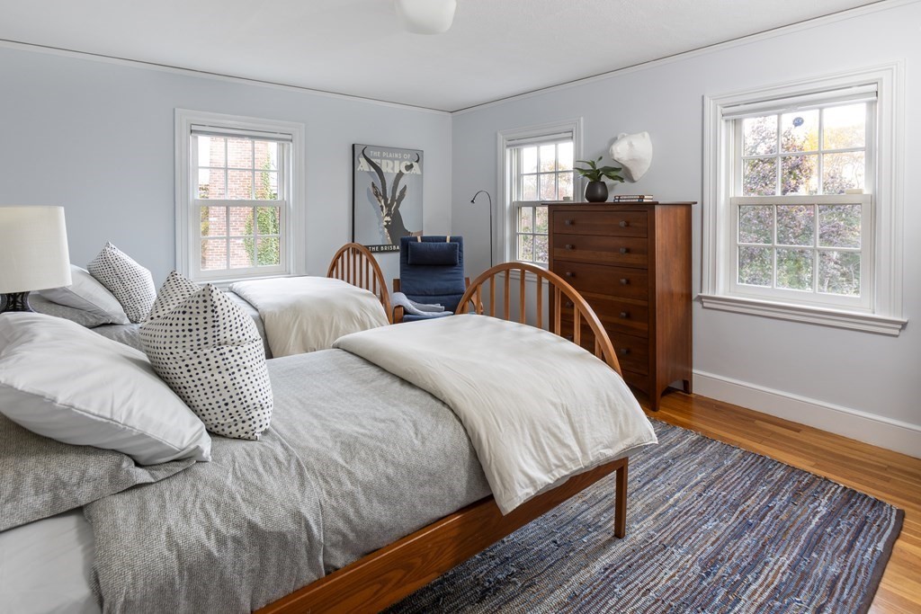47 Arlington Road Brookline, MA 02467 - Photo 22 of 29 a bedroom with two beds and a window