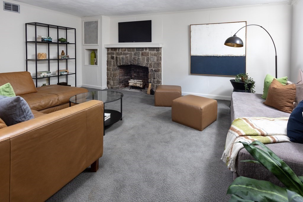 47 Arlington Road Brookline, MA 02467 - Photo 24 of 29 a living room with furniture and a fireplace
