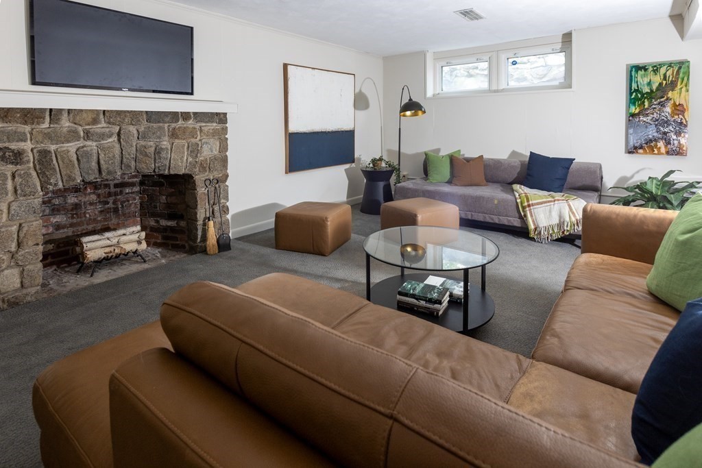 47 Arlington Road Brookline, MA 02467 - Photo 25 of 29 a living room with furniture and a fireplace