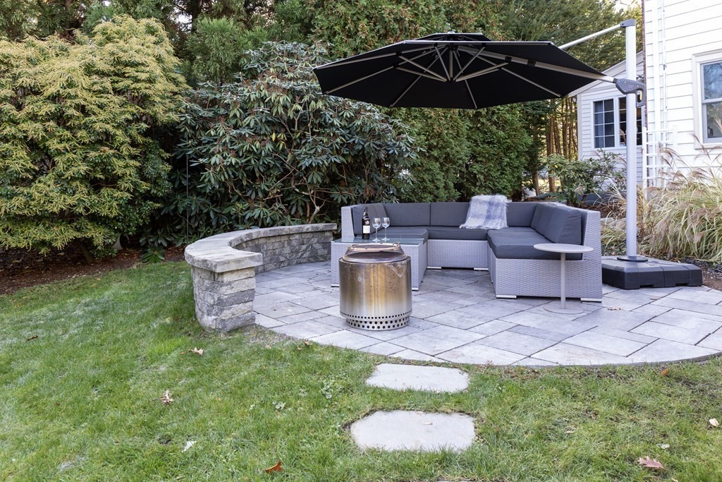 47 Arlington Road Brookline, MA 02467 - Photo 26 of 29 a view of a chair and table of the garden