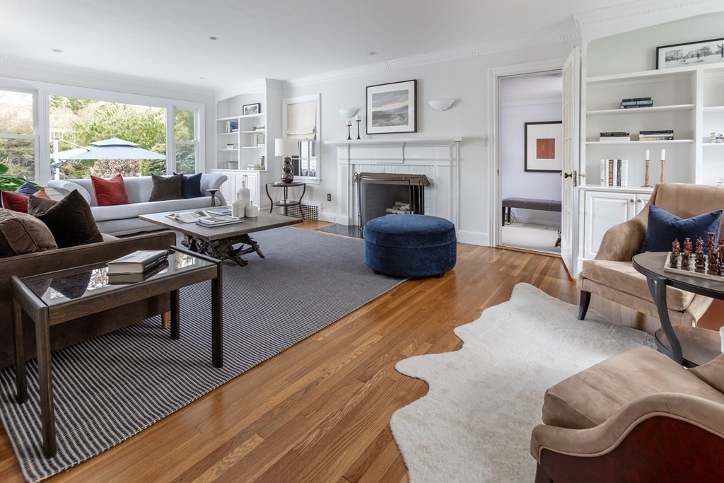 47 Arlington Road Brookline, MA 02467 - Photo 6 of 29 a living room with furniture rug and a fireplace