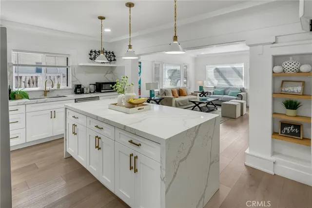 a kitchen with a stove and a white cabinet