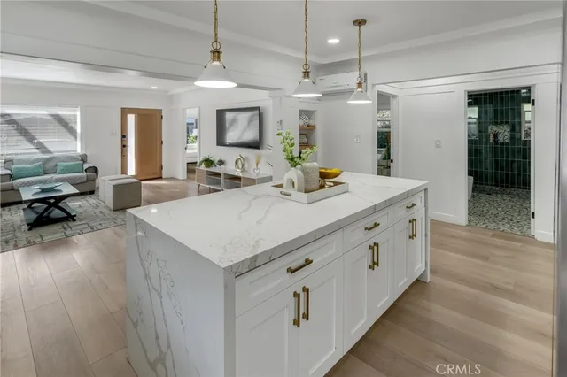 a bedroom with a bed a mirror and a large window