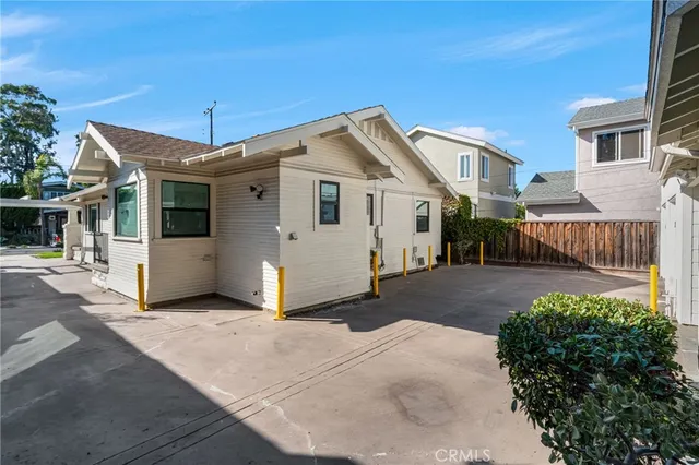 a kitchen with a sink appliances and cabinets