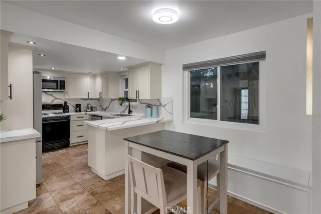 a bathroom with double vanity sinks and a mirror
