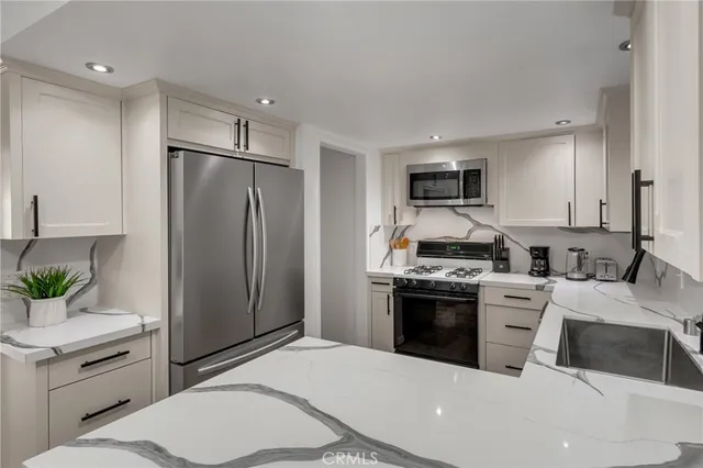 a bedroom with a large bed and a flat screen tv