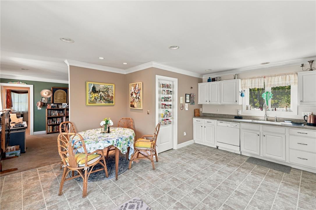 1255 Clearview Road Coplay, PA 18037 - Photo 32 of 54 Recessed lighting, tile flooring, and classic crown molding accent this kitchen and informal dining space.