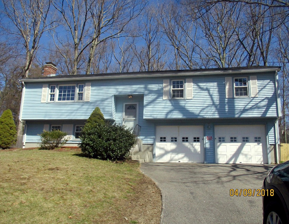 165 Swift Road Northbridge, MA 01588 - Photo 1 of 24 a front view of a house with garage