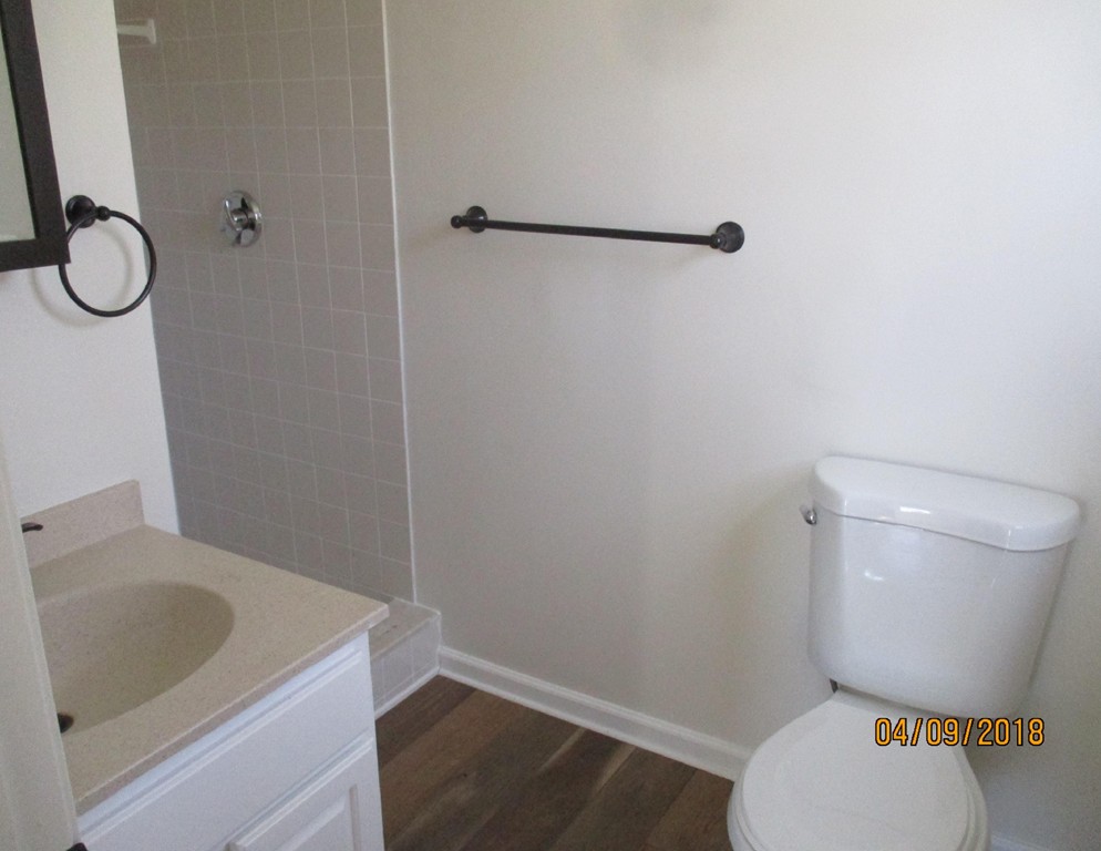 165 Swift Road Northbridge, MA 01588 - Photo 14 of 24 a white toilet sitting next to a bathroom sink