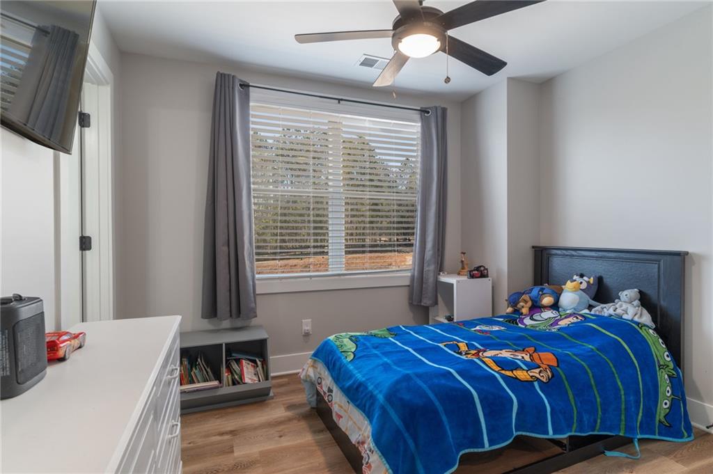 2250 Sperin Road Ball Ground, GA 30107 - Photo 47 of 56 a bedroom with a bed and a window