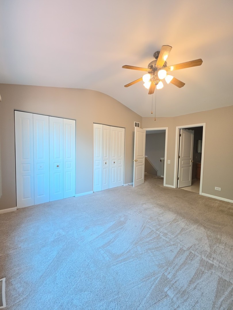 407 Spaulding Road, Unit 407 Bartlett, IL 60103 - Photo 8 of 25 a view of an empty room with a window