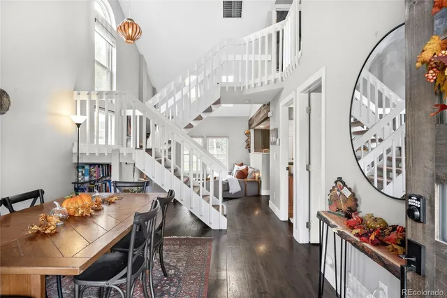 a view of entryway livingroom and hall with wooden floor