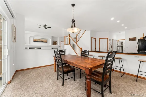 a dining room with furniture and window