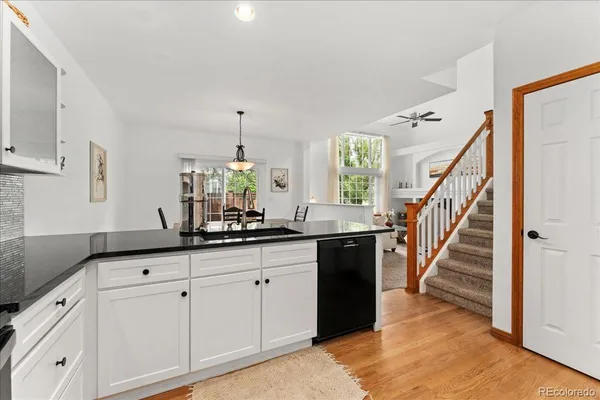 a kitchen with sink and cabinets