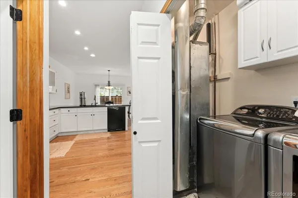 a kitchen with stainless steel appliances granite countertop a refrigerator and a stove