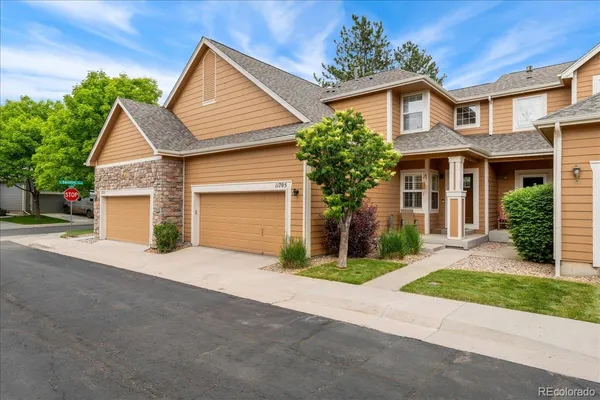 front view of a house with a small yard