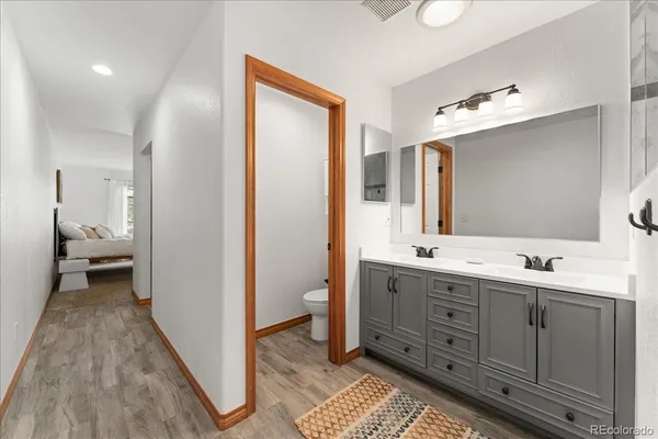 a bathroom with a double vanity sink and a mirror
