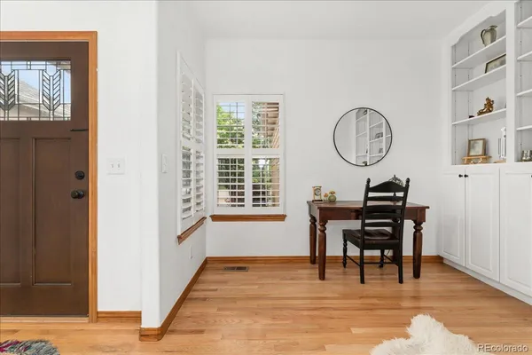 a view of a dining room with furniture window and wooden floor