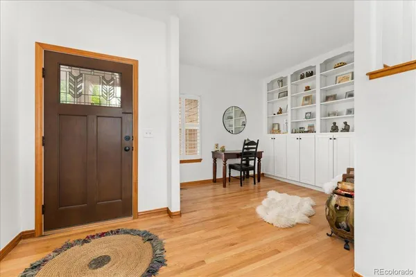 a view of a livingroom with furniture and a window