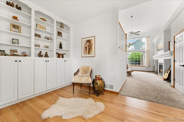 a view of a livingroom with furniture and a window