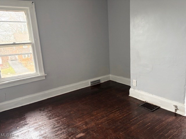 3288 Cedarbrook Road Cleveland, OH 44118 - Photo 9 of 18 Empty room featuring dark wood-style floors