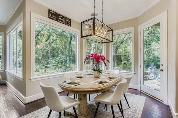 a view of a dining room with furniture window and wooden floor
