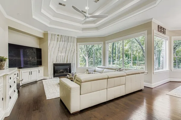 a living room with furniture and a fireplace