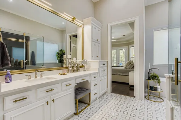 a spacious bathroom with a double vanity sink mirror and