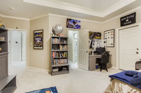 a view of a livingroom with workspace and a couch