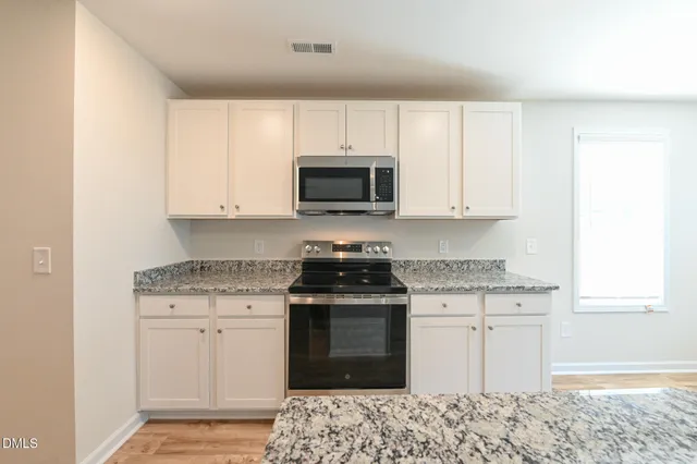 view of small space with wooden floor