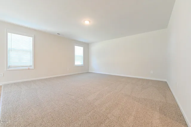a view of a kitchen with a sink and a refrigerator