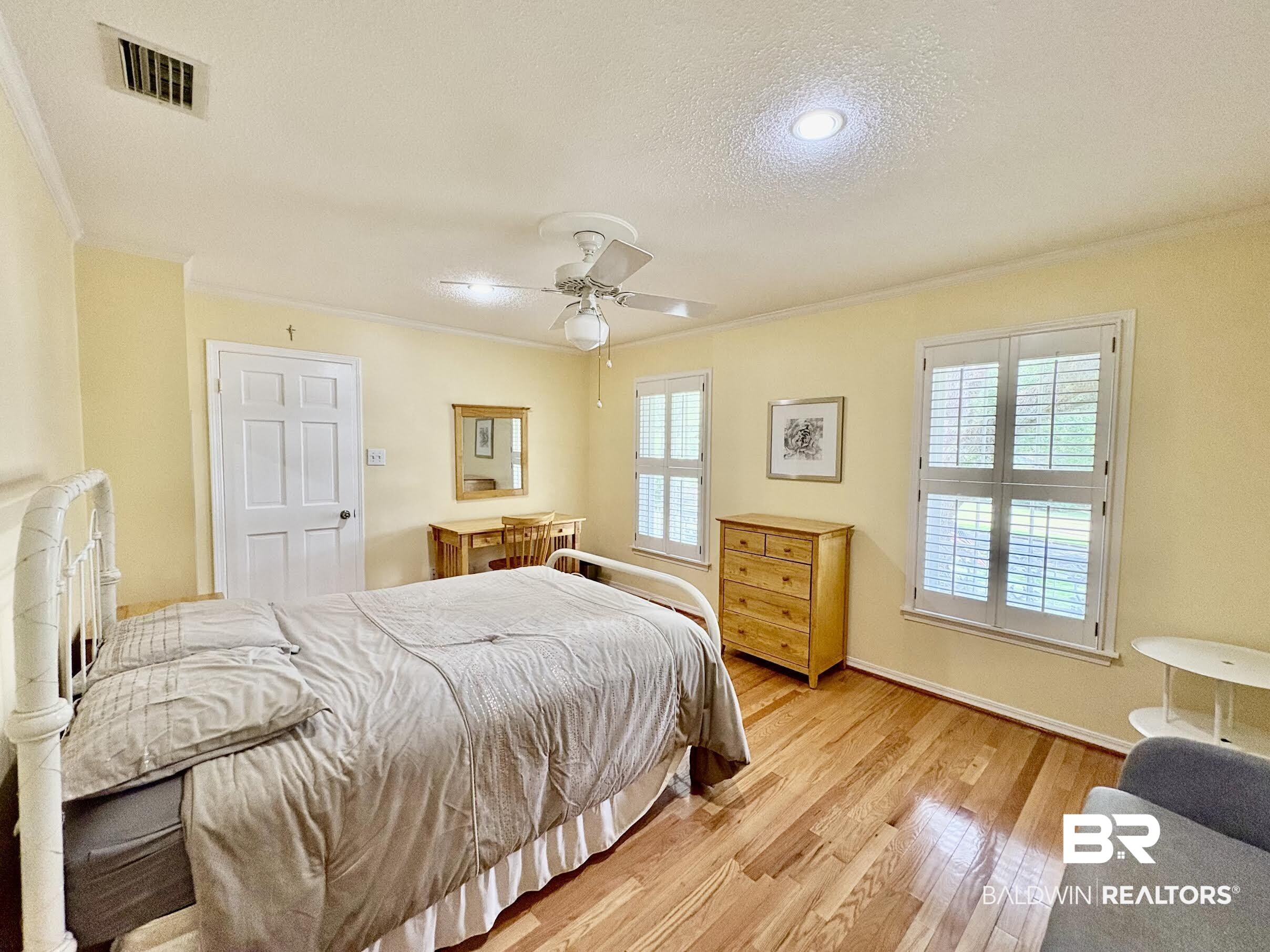6105 Brandy Run Road South Mobile, AL 36608 - Photo 33 of 45 Bedroom with ornamental molding, light wood-style flooring, a textured ceiling, a ceiling fan, and baseboards