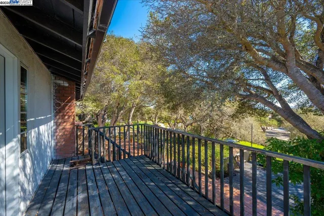 a view of balcony with wooden floor