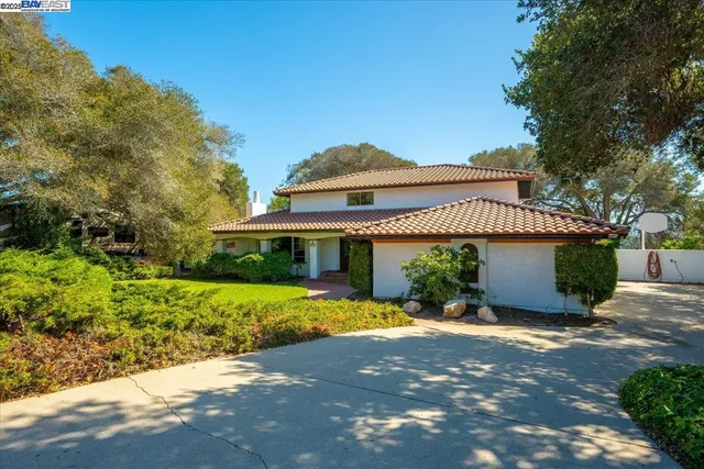 a front view of a house with yard and garage