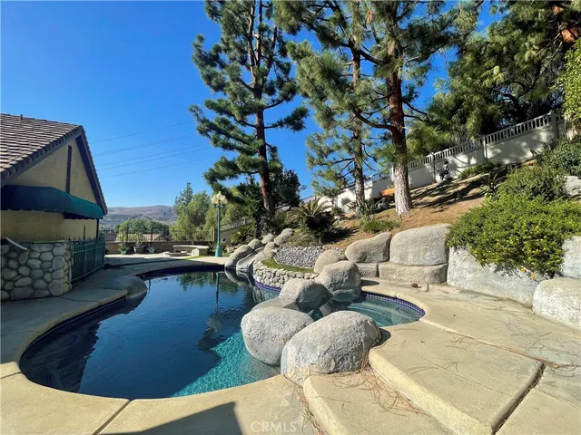 a view of swimming pool with seating space