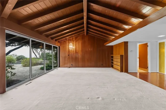 a view of a hall with a fireplace