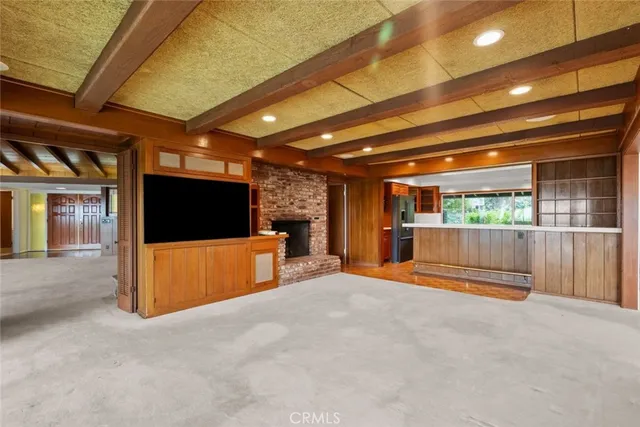 a kitchen with a stove a sink and a refrigerator