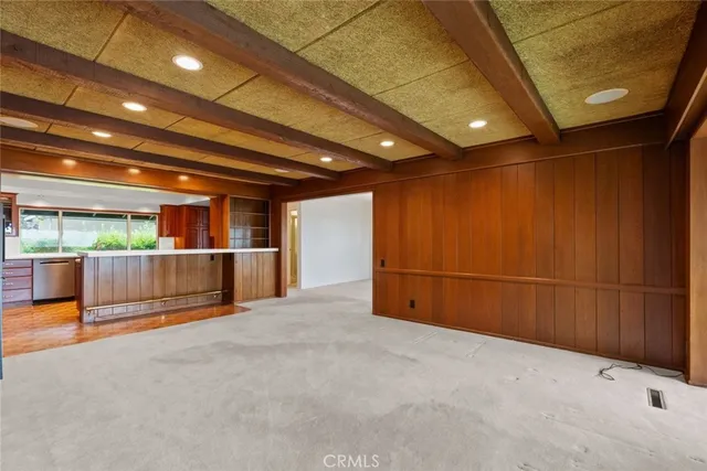 a kitchen that has a stove and a table in it