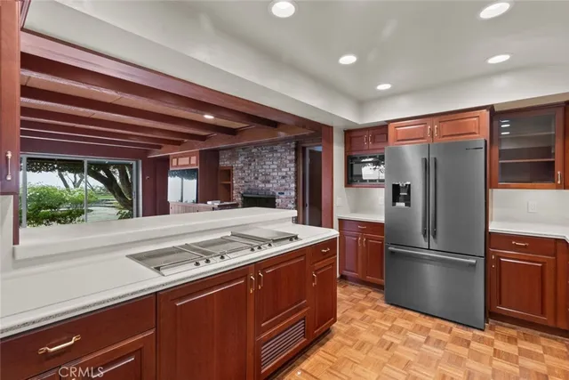a view of an empty room with a fireplace and a window