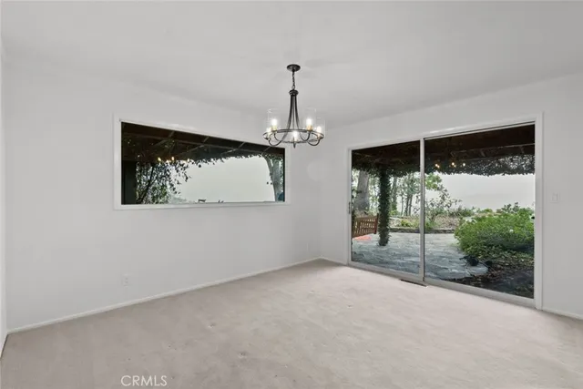 a bathroom with a shower a mirror and a sink