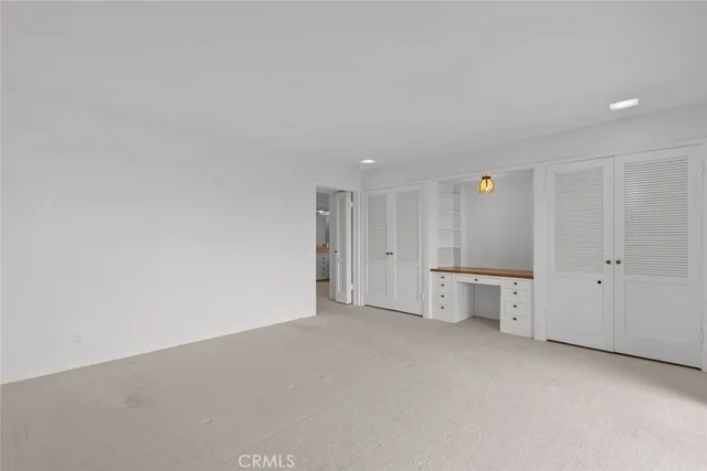 a large white kitchen with a large tub and sink