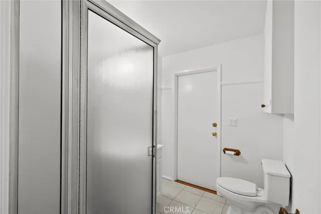 a kitchen with stainless steel appliances a stove a refrigerator and cabinets